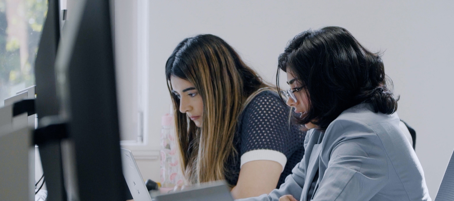 Staff viewing computer